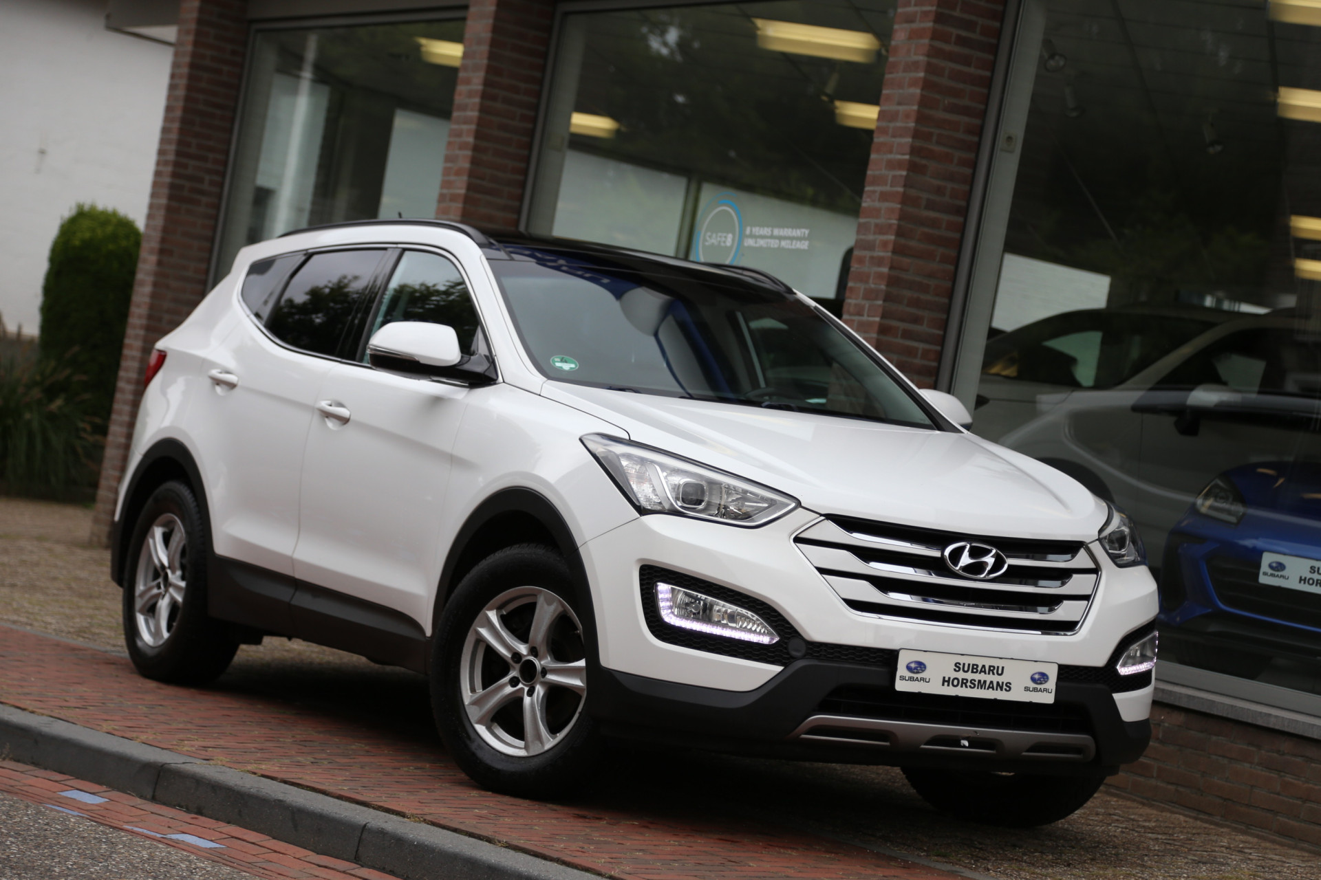 Hyundai Santa Fe 2.4i GDI i-Motion Schuifdak Camera Trekhaak 47320573-0.jpg | Subaru Horsmans